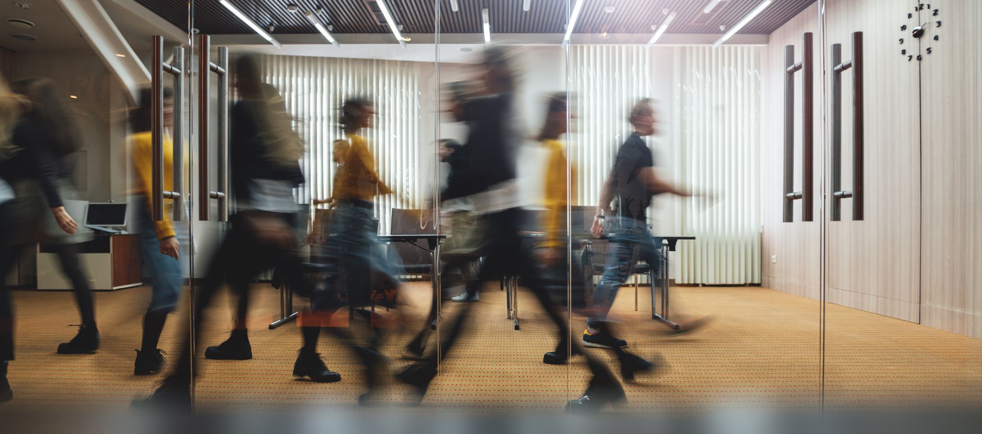People moving through a shared workplace.