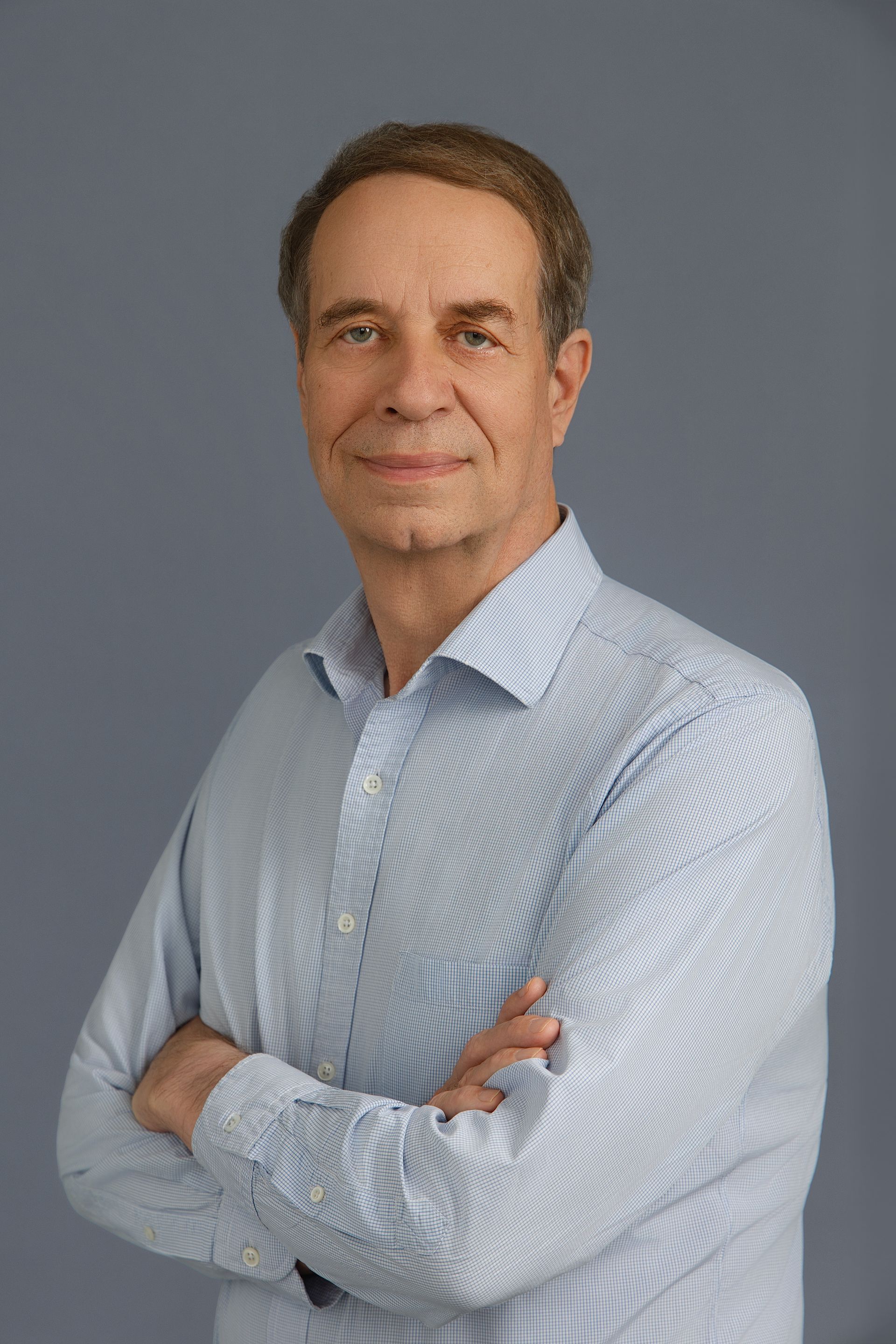 John G. Busby, Partner.
